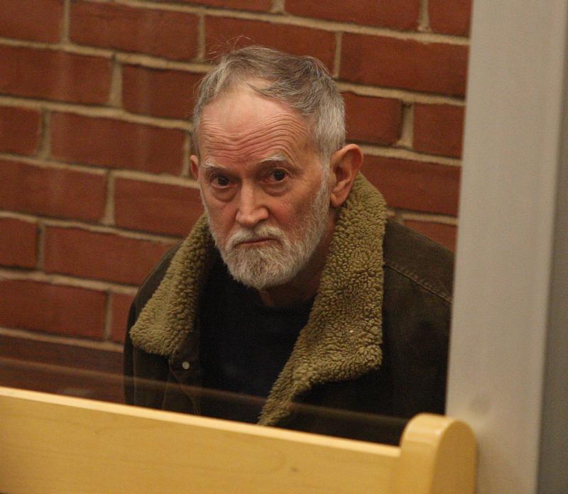 John Wittey, 70, of Berkley looks out at the court during his arraignment for the murder of 70-year-old John Williams of Wareham. Police said Witty shot and killed Williams in his Glen Charlie Road home in early February after discovering his deceased wife had an affair with Williams. Wittey was indicted for the murder in May. BY GEORGE RIZER